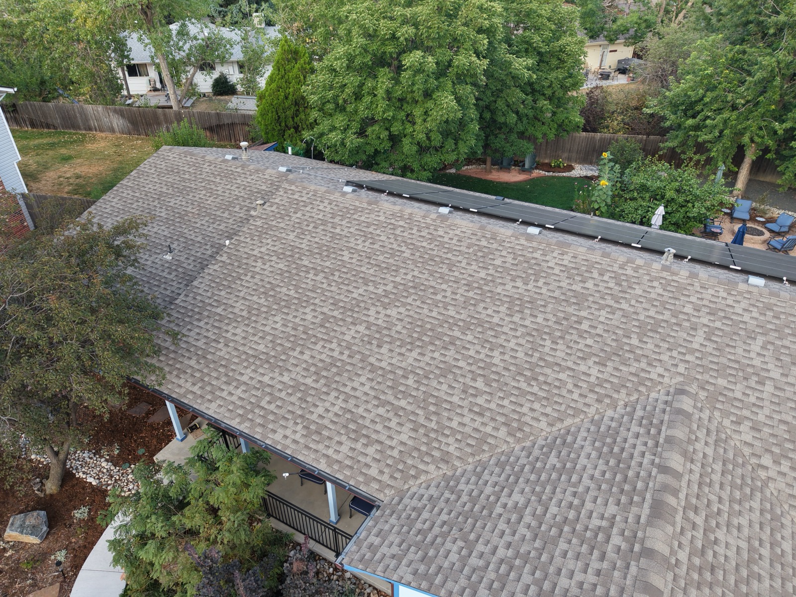 Aerial inspection of a shingle roof with a solar array installation