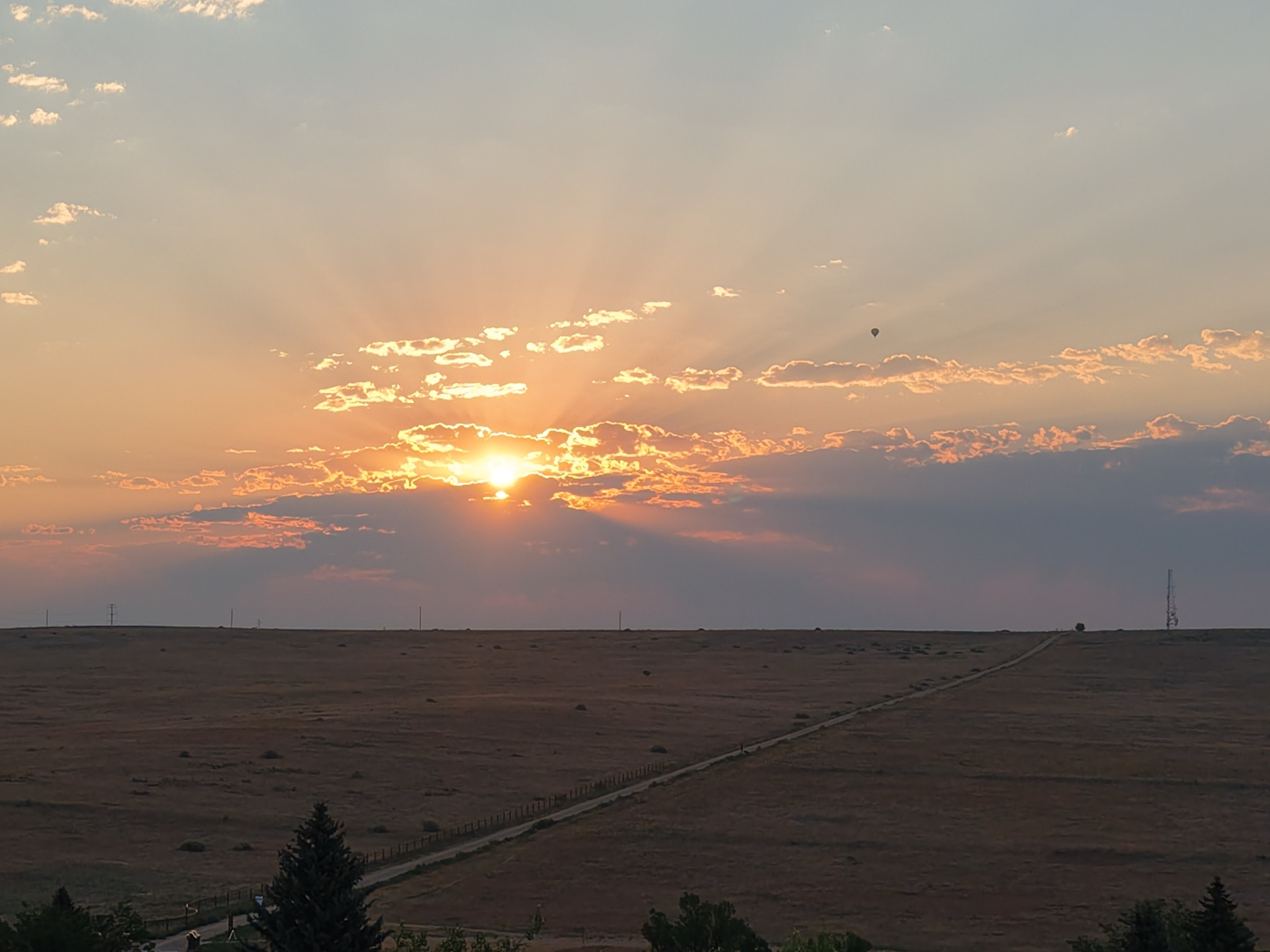 Sunrise over the plains with a hot air balloon, shot near Niwot, Colorado
